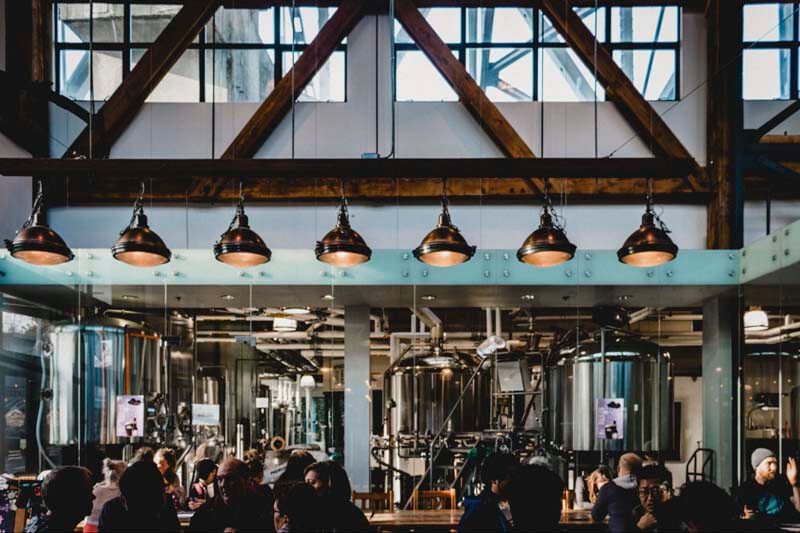 Photo of a busy brewery filled with customers