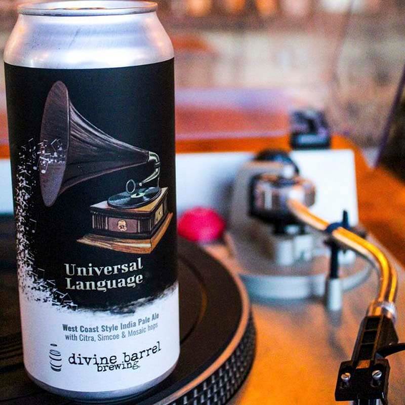 An up-close photo of the Universal Language beer can label design from Dave Kaminsky and Divine Barrel Brewing