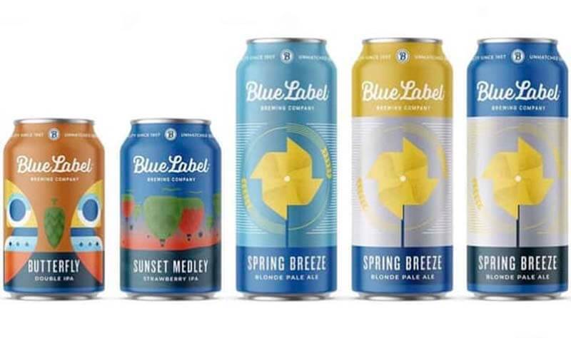 A variety of beer cans of various sizes featuring bright and colorful beer can labels from Blue Label Packaging