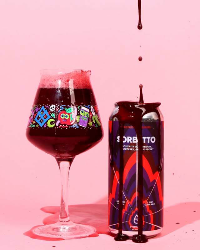 A dark red colored craft beer made with fruit purees