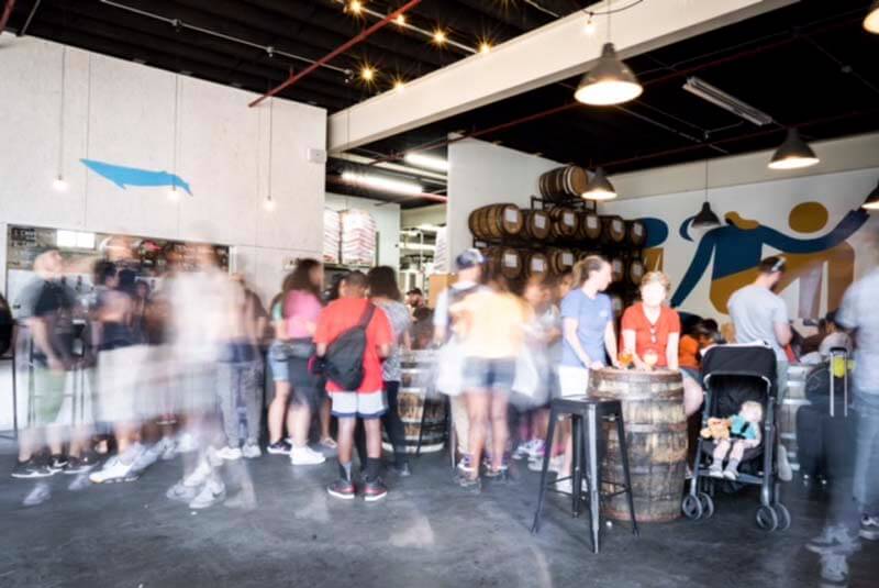 Inside one of Finback Brewery's multiple taproom locations in Queens, New York during a busy happy hour rush