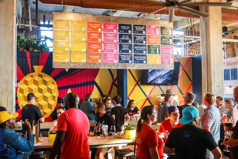 Bright and colorful interior taproom at Monday Night Brewing's brewery location