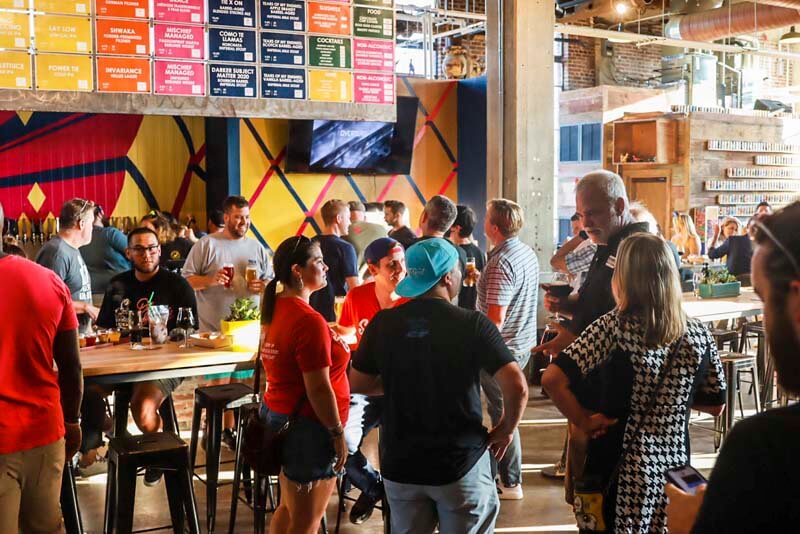 Inside one of Monday Night Brewing's multiple taproom locations during a busy happy hour session