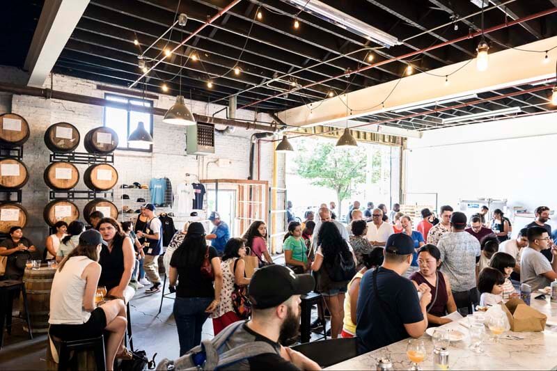 A photo Finback Brewing's brewery location interiior filled with patrons
