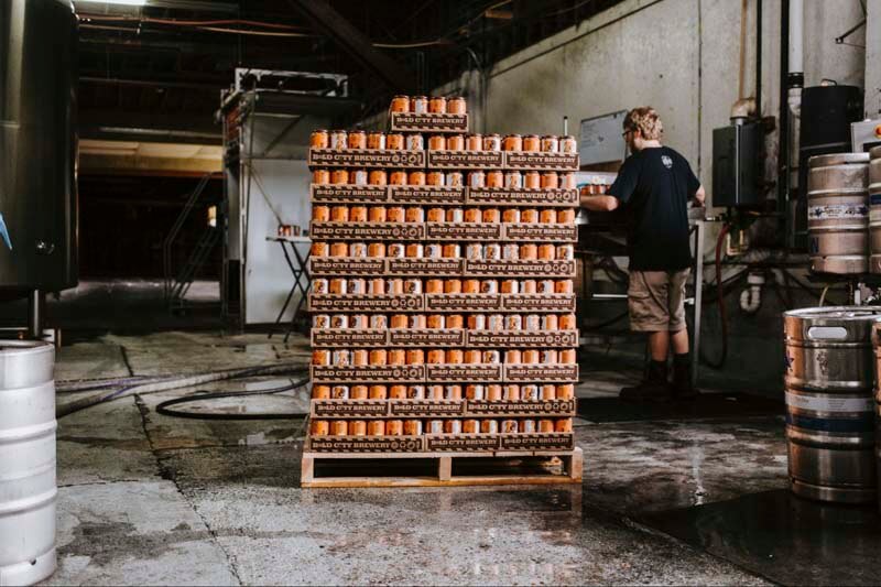 A brewery warehouse getting ready to ship a pallet of craft beer cans