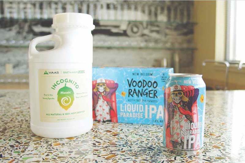 Incognito dry hopping jug sitting on table next to Voodoo Ranger craft beer can from New Belgium Brewing Co.