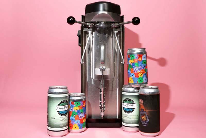 A promotional photo of the Oktober Can Seamer with various sizes of craft beer cans