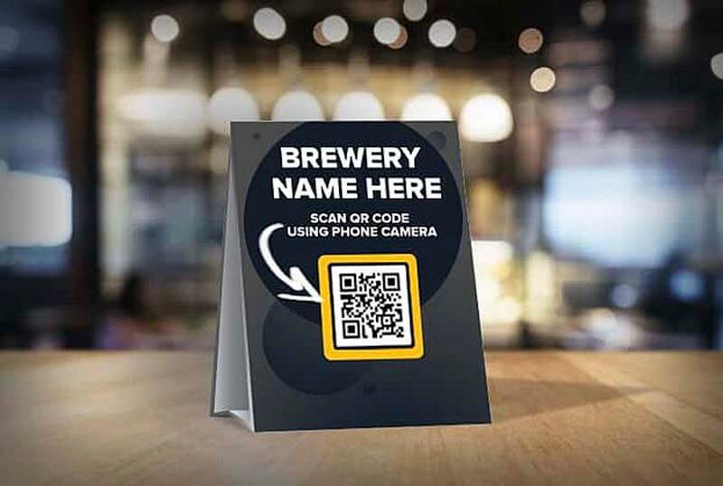 A tent card featuring a QR code menu from Untappd for Business