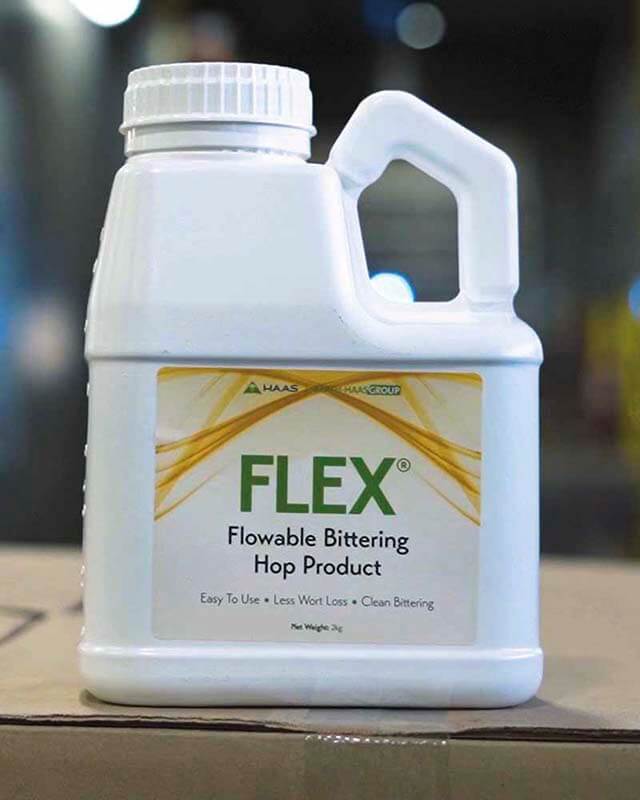 A close up photo of a container of FLEX flowable bittering hop product