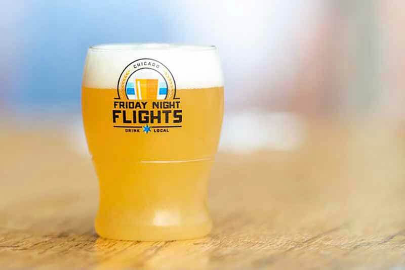 Up close photo of a commemorative glass from the Friday Night Flights, an Illinois Craft Brewer's Guild event