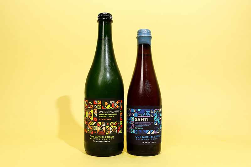 A photo of Our Mutual Friend (OMF) Weirding Way and Sahti farmhouse ales side-by-side
