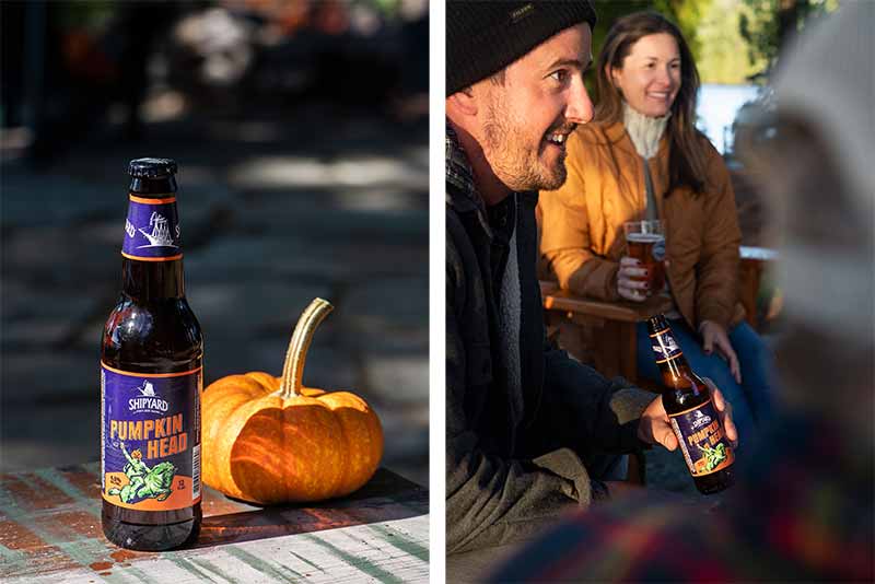 A promotional photo of Pumpkin Head from Shipyard Brewing Company with a group of people enjoying the pumpkin flavored craft beer