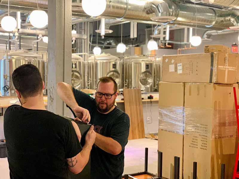 Brewers at Castle Island Brewing Co. prepare brewhouse for a new brew kettle