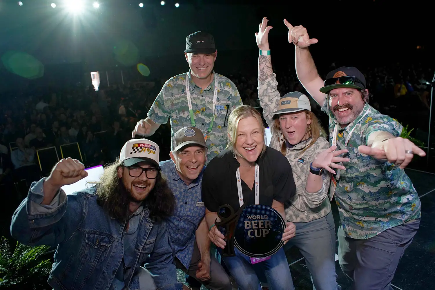 A group of 2025 World Beer Cup winners celebrating on stage